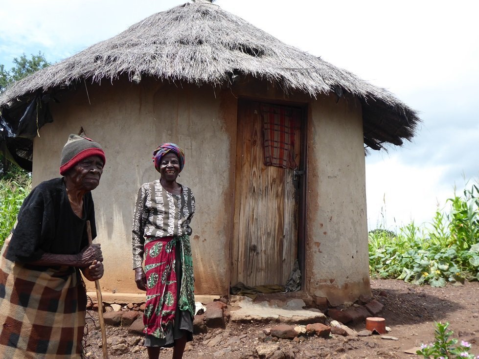 Susan and her mother Mazvipesa use cash from CARE to buy food, soap, seeds and to complete home repairs.